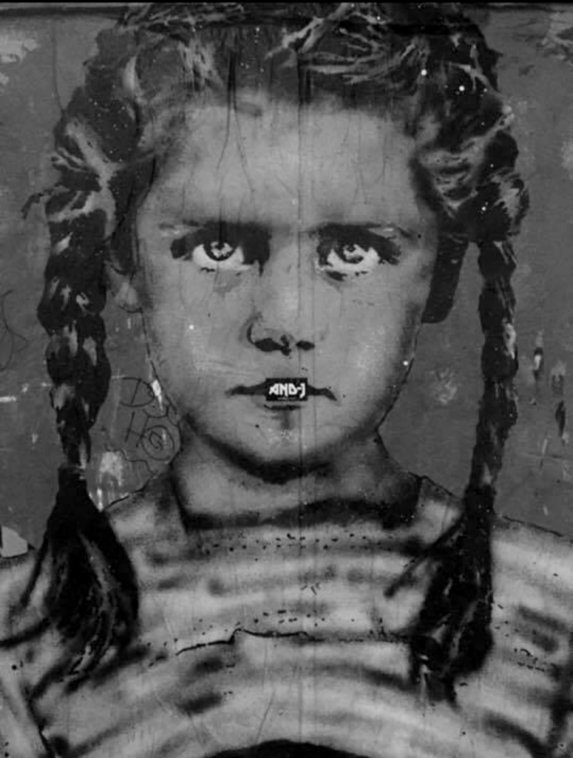 AND-J artwork on a monochrome portrait